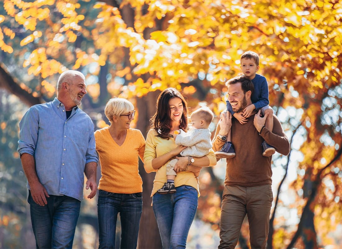 Read Our Reviews - Multi-Generational Family at the Park Having Fun in Autumn